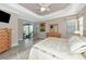 Primary bedroom with sliding doors leading to the backyard patio at 24160 Gallberry Dr, Venice, FL 34293