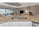 Kitchen island with granite countertop and double sink at 24160 Gallberry Dr, Venice, FL 34293