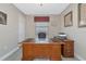 Home office with large wood desk and leather chair at 24160 Gallberry Dr, Venice, FL 34293