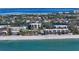 Aerial view of condo building near beach and waterway at 3240 Gulf Of Mexico Dr # B504, Longboat Key, FL 34228