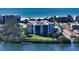 Aerial photo showing condo building near beach and waterway at 3240 Gulf Of Mexico Dr # B504, Longboat Key, FL 34228