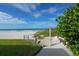 Beach access with outdoor shower and bench at 3240 Gulf Of Mexico Dr # B504, Longboat Key, FL 34228