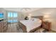 Main bedroom with king-size bed and water views at 3240 Gulf Of Mexico Dr # B504, Longboat Key, FL 34228