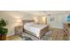 Bright bedroom with king-size bed and ensuite bathroom at 3240 Gulf Of Mexico Dr # B504, Longboat Key, FL 34228