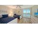 Guest bedroom with twin beds and water view at 3240 Gulf Of Mexico Dr # B504, Longboat Key, FL 34228