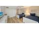 Two twin beds in a well-lit guest bedroom at 3240 Gulf Of Mexico Dr # B504, Longboat Key, FL 34228