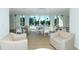 Bright community room with comfortable seating and large windows at 3240 Gulf Of Mexico Dr # B504, Longboat Key, FL 34228