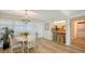 Charming dining area with table and chairs, near kitchen at 3240 Gulf Of Mexico Dr # B504, Longboat Key, FL 34228