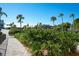 Landscaped entryway with a paved pathway at 3240 Gulf Of Mexico Dr # B504, Longboat Key, FL 34228