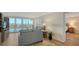 Living room with hardwood floors, light walls, and water views at 3240 Gulf Of Mexico Dr # B504, Longboat Key, FL 34228