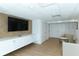 Comfortable lounge area with large TV and seating at 3240 Gulf Of Mexico Dr # B504, Longboat Key, FL 34228