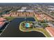 Aerial view of community featuring pool, lake, and townhouses at 3815 Parkridge Cir # 2-203, Sarasota, FL 34243