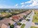 Community overview: even rows of villas with tile roofs and lush landscaping at 3841 Albacete Cir # 51, Punta Gorda, FL 33950