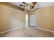 Bedroom with ceiling fan, double closets, and tile floor at 3841 Albacete Cir # 51, Punta Gorda, FL 33950