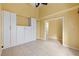 Bedroom with white built-ins and access to hallway at 3841 Albacete Cir # 51, Punta Gorda, FL 33950