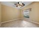 Bright bedroom with ceiling fan and tile floor at 3841 Albacete Cir # 51, Punta Gorda, FL 33950
