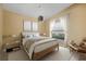 Bedroom with wood bed frame and neutral decor at 3841 Albacete Cir # 51, Punta Gorda, FL 33950