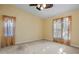 Bright bedroom with two windows and carpet at 3841 Albacete Cir # 51, Punta Gorda, FL 33950