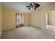 Spacious bedroom with ceiling fan and neutral carpeting at 3841 Albacete Cir # 51, Punta Gorda, FL 33950