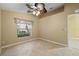 Bedroom with window, ceiling fan and tile floor at 3841 Albacete Cir # 51, Punta Gorda, FL 33950