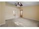 Well-lit bedroom with ceiling fan and ample space at 3841 Albacete Cir # 51, Punta Gorda, FL 33950