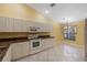 Kitchen with white cabinets and granite countertops at 3841 Albacete Cir # 51, Punta Gorda, FL 33950