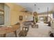 Open-concept living space with neutral decor and access to a patio at 3841 Albacete Cir # 51, Punta Gorda, FL 33950