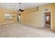 Living room with chandelier, ceiling fan and carpet at 3841 Albacete Cir # 51, Punta Gorda, FL 33950