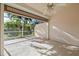 Relaxing screened patio with ceiling fan overlooking backyard at 3841 Albacete Cir # 51, Punta Gorda, FL 33950