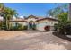Stunning home with a tile roof, manicured landscaping, a brick driveway, and a two-car garage at 4946 Brywill Cir, Sarasota, FL 34234
