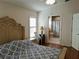 Comfortable bedroom with hardwood floors featuring an ensuite bathroom at 5115 44Th St W, Bradenton, FL 34210