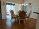 Open-concept dining area features a glass table and slider doors leading to outdoor area at 5115 44Th St W, Bradenton, FL 34210