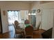 Open-concept dining area features a glass table and slider doors leading to outdoor area at 5115 44Th St W, Bradenton, FL 34210