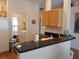 Kitchen boasts a breakfast bar and access to laundry at 5115 44Th St W, Bradenton, FL 34210