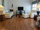 Bright and airy living room with ample seating, TV, and large windows with natural light at 5115 44Th St W, Bradenton, FL 34210