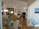 Open-concept living and dining area with natural light, wood floors, and neutral decor at 5115 44Th St W, Bradenton, FL 34210