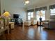 Bright and airy living room with ample seating, TV, and large windows with natural light at 5115 44Th St W, Bradenton, FL 34210
