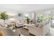 This living room features two couches, two chairs and a patio at 512 W Venice Ave # 401, Venice, FL 34285