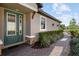 Green front door with sidelights and a brick walkway leading to the entrance at 5824 Semolino St, Nokomis, FL 34275