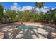 Community hot tub surrounded by landscaping at 5824 Semolino St, Nokomis, FL 34275