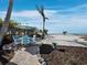 A tranquil backyard seating area on the beach with beautiful ocean views at 6161 Gulf Of Mexico Dr, Longboat Key, FL 34228