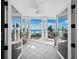 Relaxing balcony with outdoor seating and panoramic views of the beach and ocean at 6161 Gulf Of Mexico Dr, Longboat Key, FL 34228