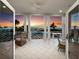 Charming balcony with comfortable seating and stunning sunset views over the ocean at 6161 Gulf Of Mexico Dr, Longboat Key, FL 34228