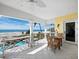 Balcony with ocean views from the dining area; the perfect blend of relaxation and dining while enjoying the seascape at 6161 Gulf Of Mexico Dr, Longboat Key, FL 34228