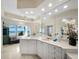Spacious bathroom featuring double sinks, white cabinetry, vanity area, garden tub, and amazing beach views at 6161 Gulf Of Mexico Dr, Longboat Key, FL 34228
