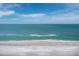 Scenic beach view with a clear blue sky and calm turquoise waters, offering a serene coastal experience at 6161 Gulf Of Mexico Dr, Longboat Key, FL 34228