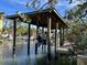Boat in a covered dock on the waterfront at 6161 Gulf Of Mexico Dr, Longboat Key, FL 34228