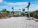A waterfront property with a beautiful backyard, pool, and beach access at 6161 Gulf Of Mexico Dr, Longboat Key, FL 34228