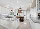Bright kitchen with white cabinets, marble countertops, and a butcher block island at 6161 Gulf Of Mexico Dr, Longboat Key, FL 34228