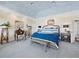 The spacious bedroom is highlighted by elegant furnishings, a statement bed, and inviting ambiance for rest and relaxation at 6161 Gulf Of Mexico Dr, Longboat Key, FL 34228